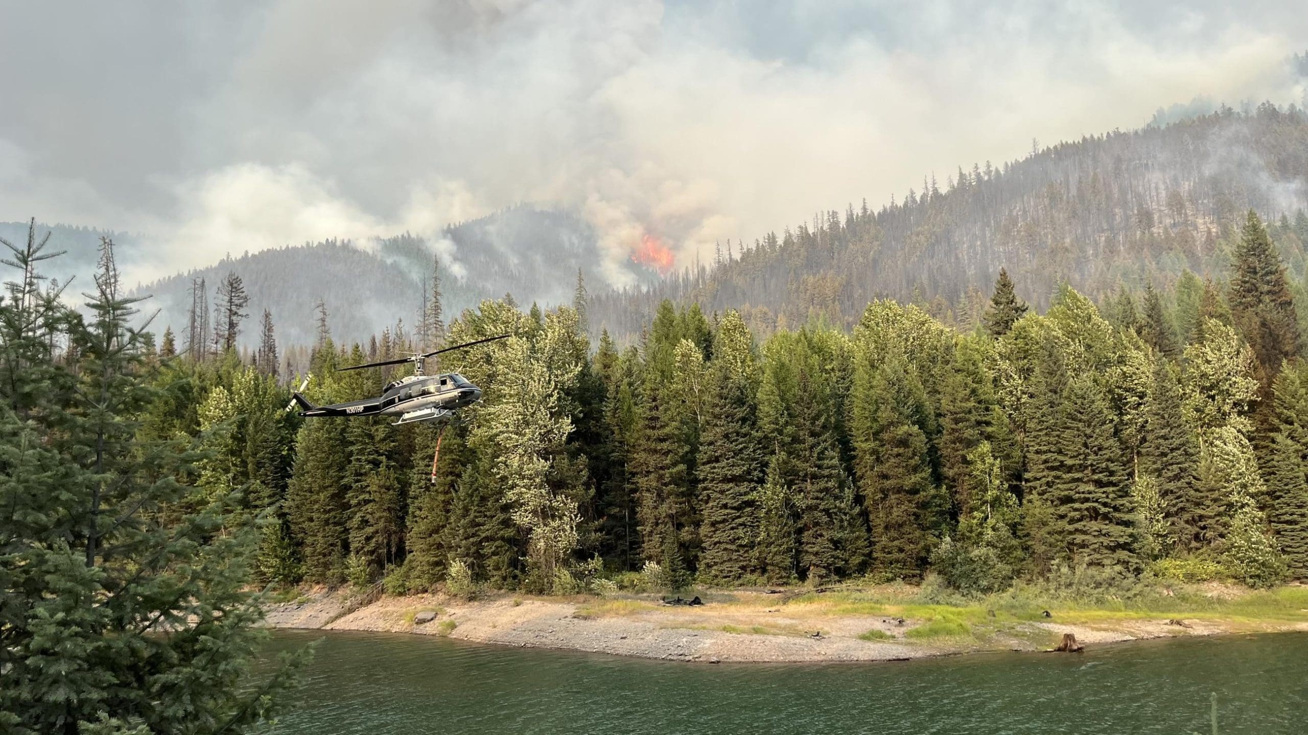 Credit Inciweb Helicopter Getting Water From Hungry Horse Reservoir