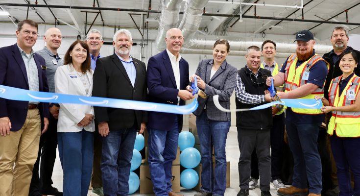 Gov. Gianforte helping cut the ribbon on the Amazon delivery station in Great Falls. Photo credit Office of the Governor 